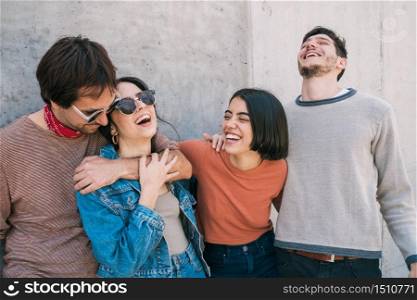 Portrait of young group of friends spending good time together and having fun outdoors. Lifestyle and friendship concept.