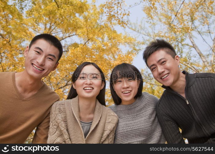 Portrait of young group of people in park