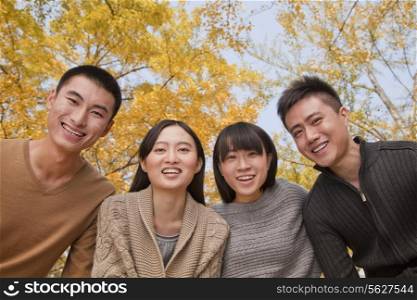 Portrait of young group of people in park