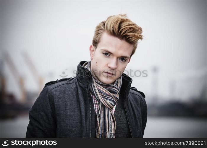 Portrait of young handsome man fashion model casual style on street outdoors