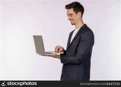 Portrait of young handsome smiling businessman holding laptop in hands, typing and browsing web pages isolated on white background. Technology and business concept.