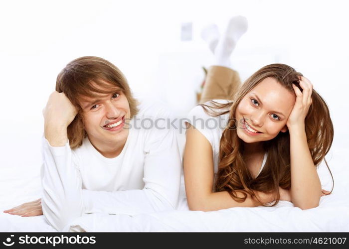 Portrait of young happy couple at home