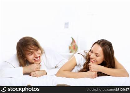 Portrait of young happy couple at home