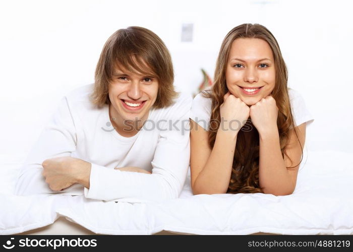 Portrait of young happy couple at home