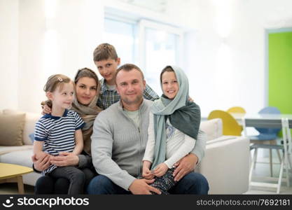 portrait of young happy modern muslim family before iftar dinner during ramadan feast at home