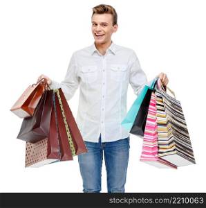 Portrait of young happy smiling man with shopping bags, isolated over white background. Portrait of young happy smiling man with shopping bags