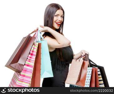 Portrait of young happy smiling woman with shopping bags, isolated over white background. Portrait of young happy smiling woman with shopping bags