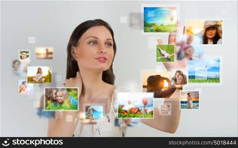 Portrait of young happy woman sharing her photo and video files in social media