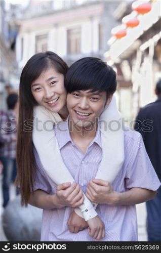 Portrait of Young Heterosexual Couple Embracing Outdoors in Beijing
