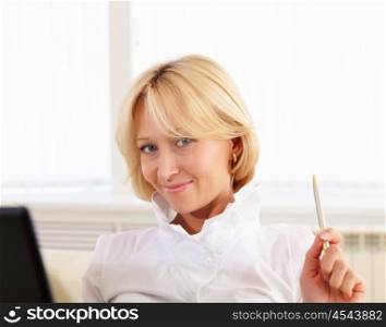 portrait of young lady with notebook in office