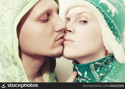 Portrait of young lovers kissing