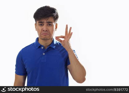 Portrait of young man gesturing against white background