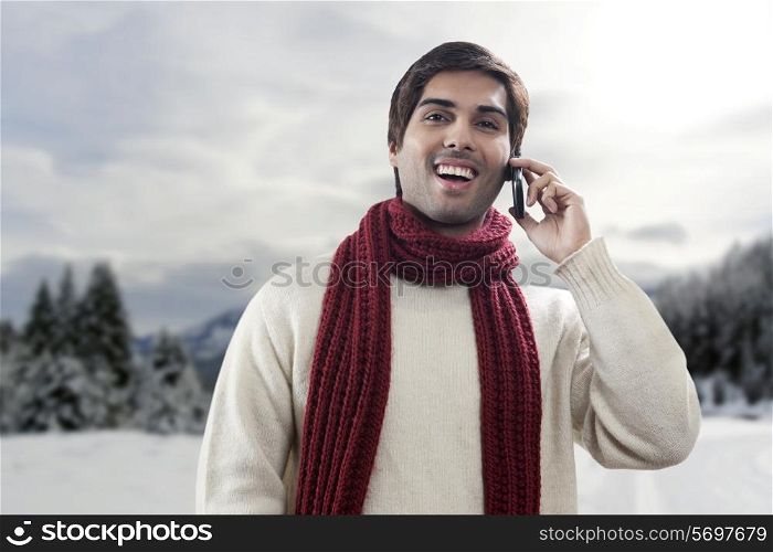 Portrait of young man having conversation on mobile phone