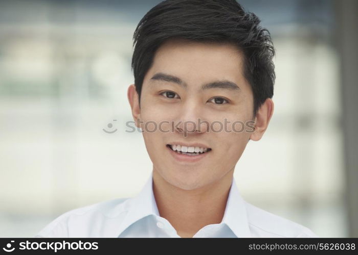 Portrait of young man, head and shoulders, Beijing, China