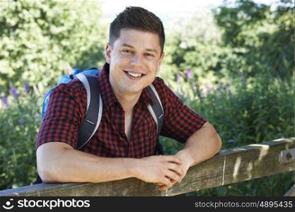 Portrait Of Young Man Hiking In Countryside