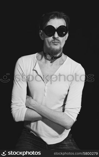 Portrait of young man in round sunglasses closeup