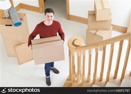 Portrait Of Young Man Moving Into New Home