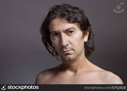 Portrait of young man on a dark background