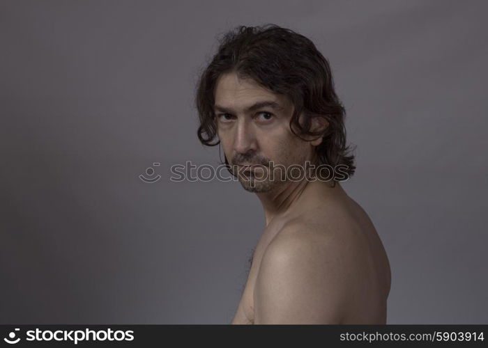 Portrait of young man on a dark background