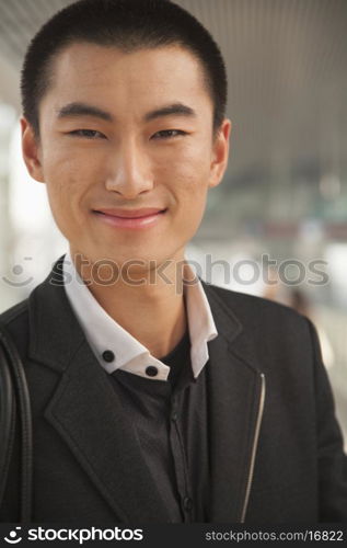 Portrait of Young Man on Train Platform