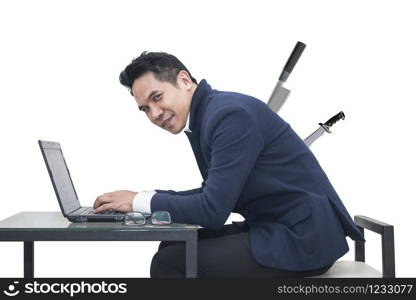 Portrait of young man sitting working on laptop at his desk on white background,Persistence Concept. A man is working harder to achieve new sales target.