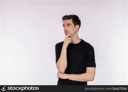 Portrait of young man thinking touching chin isolated over white background. Thinking worried about a question, concerned and nervous with hand on chin.