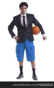 Portrait of young man with basketball