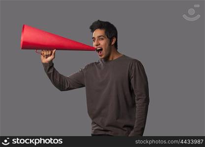 Portrait of young man with megaphone