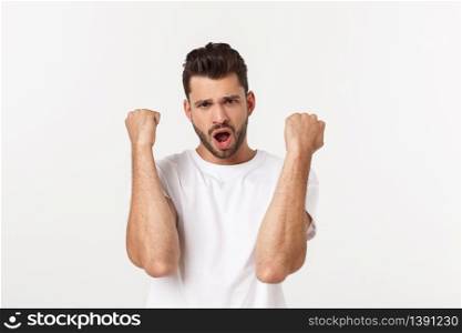 Portrait of young man with shocked facial expression, isolated over white background. Portrait of young man with shocked facial expression, isolated over white background.