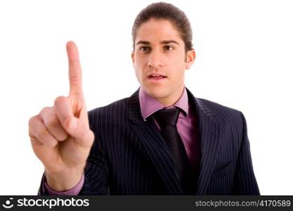 portrait of young manager showing index finger against white background