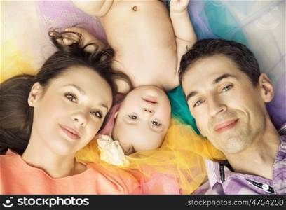 Portrait of young parents with their beloved child
