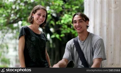 Portrait of young people at school, two happy college students smiling and looking at camera. Sequence