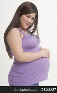 Portrait of young pregnant woman