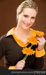 Portrait of young romantic woman hold flower gerbera daisy