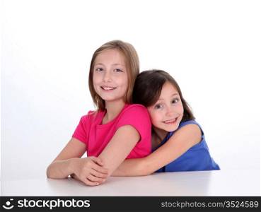 Portrait of young sisters showing complicity
