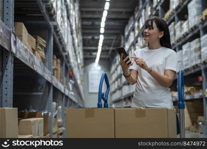 Portrait of young smart asian female shopping new lifestyle , Smiling asia woman standing between of stock product inventory on shelf compare products on the phone