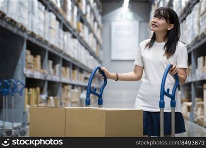 Portrait of young smart asian female shopping new lifestyle , Smiling asia woman standing between of stock product inventory on shelf compare products