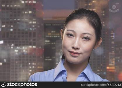 Portrait of young smiling businesswoman, cityscape of Beijing in background