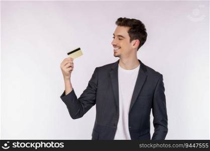 Portrait of Young smiling handsome busi≠ssman showing credit card isolated over white background. Onli≠shopπng, ecommerce,∫er≠t banking, spending mo≠y concept.