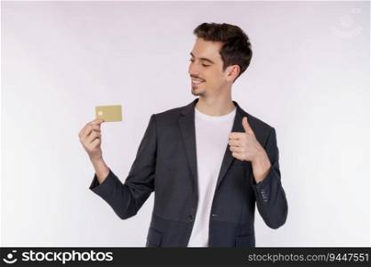 Portrait of Young smiling handsome businessman in casual clothes showing credit card and thumb up isolated over white background. Online shopping, ecommerce, internet banking, spending money concept.