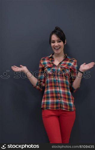 portrait of young startup business woman at modern office, grey chalkboard wall in background