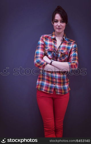 portrait of young startup business woman at modern office, grey chalkboard wall in background