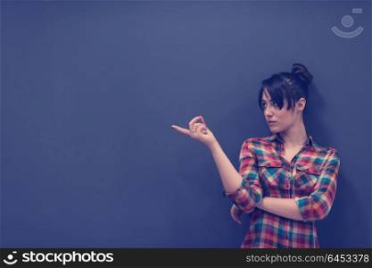 portrait of young startup business woman at modern office, grey chalkboard wall in background