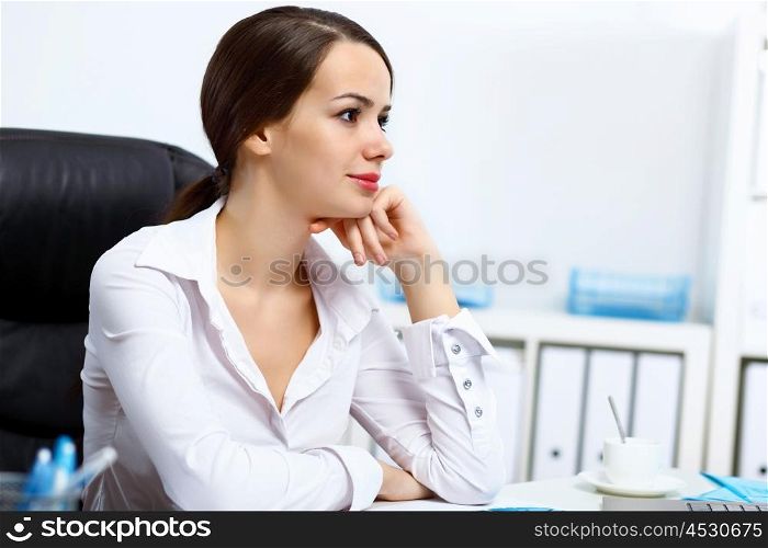 Portrait of young successful businesswoman in the office