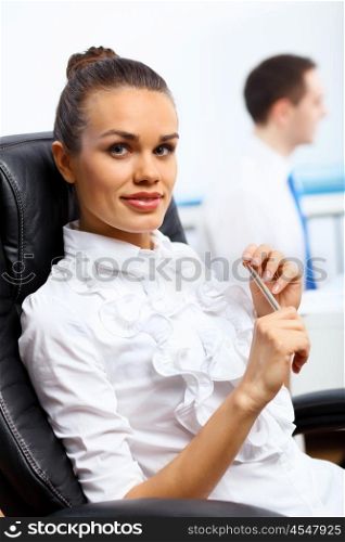 Portrait of young successful businesswoman in the office