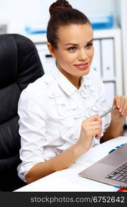 Portrait of young successful businesswoman in the office