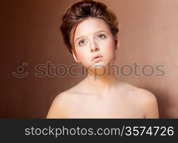 Portrait of Young Teen Girl over Beige Background