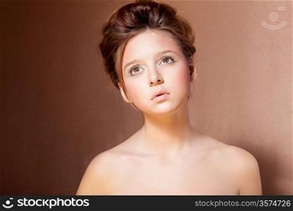 Portrait of Young Teen Girl over Beige Background