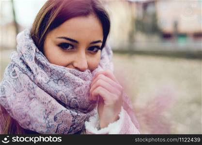 Portrait of young teenage girl in spring at Park with scarf