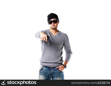 Portrait of young trendy african man posing with handgun